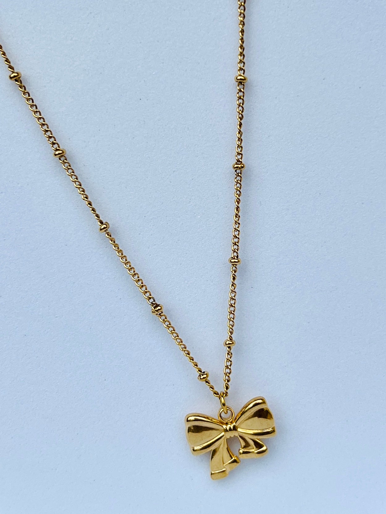 Golden Bow Pendant Necklace